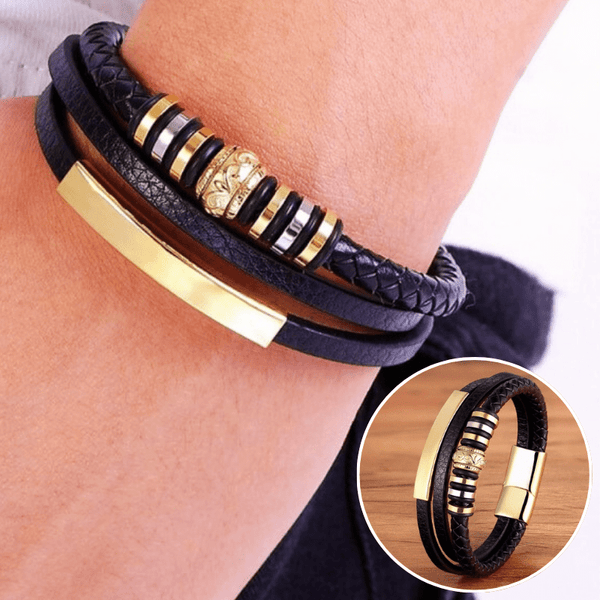 bracelet en cuir tribal double couches or porté et posé sur du bois