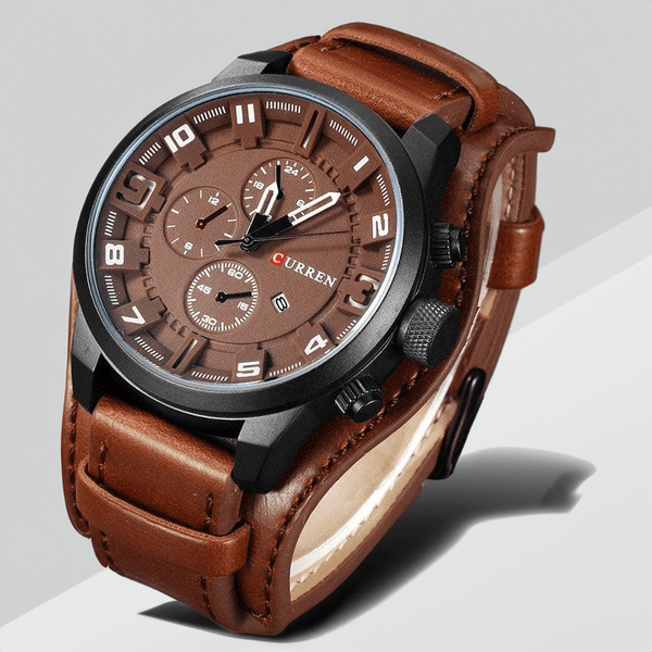 Montre en cuir chronographe marron sur fond gris