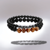 Bracelet en pierres de lave noires avec perles d'agate marron sur fond dégradé