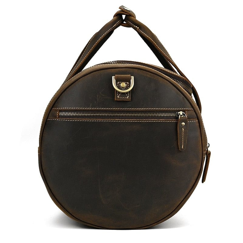 sac de voyager cuir marron vintage côté rond sur fond blanc